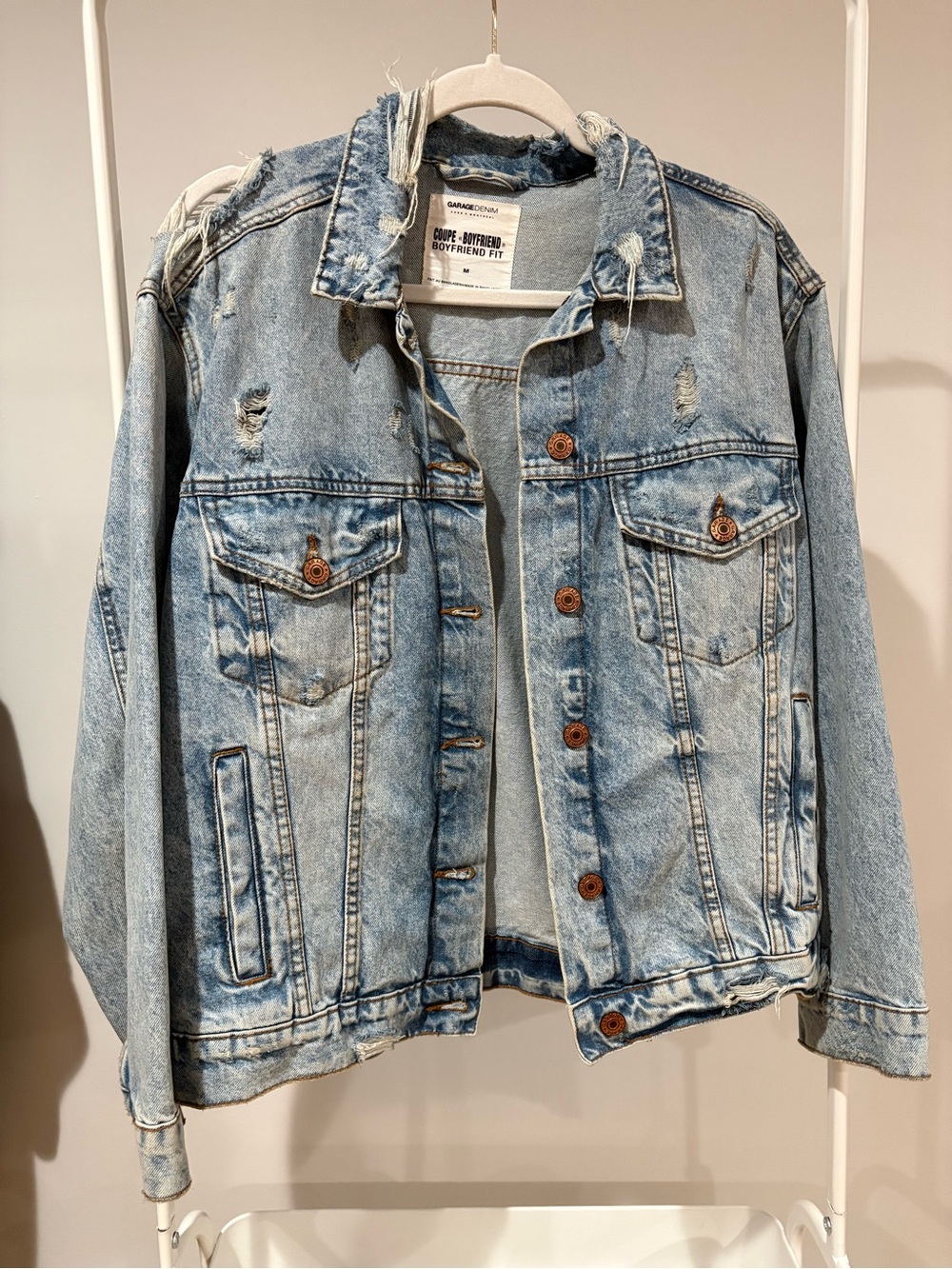Garage Denim "Boyfriend Fit" jacket in a distressed light wash